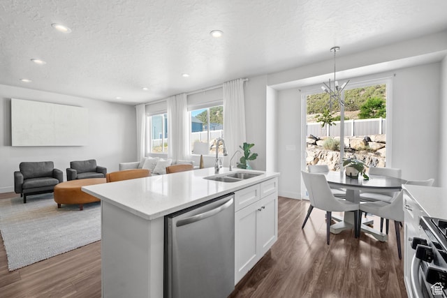 3712 E Long Ridge Dr Unit 124, Eagle Mountain, UT 84005 - kitchen featuring stainless steel dishwasher, range, dark wood finished floors, light countertops, and a textured ceiling