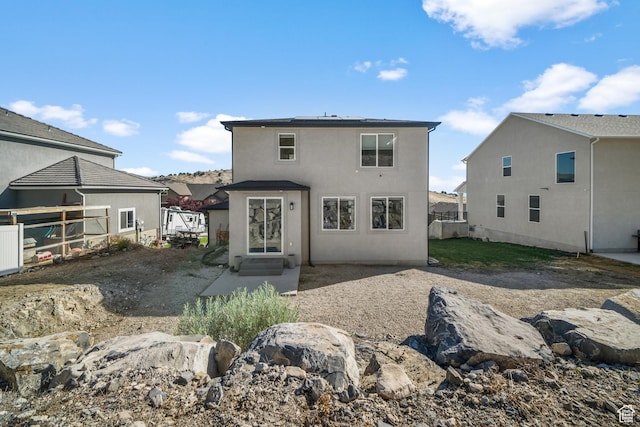 3712 E Long Ridge Dr Unit 124, Eagle Mountain, UT 84005 - rear view of house featuring stucco siding