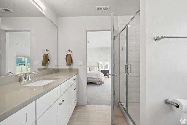 3712 E Long Ridge Dr Unit 124, Eagle Mountain, UT 84005 - full bath featuring vanity, connected bathroom, a shower stall, and tile patterned floors