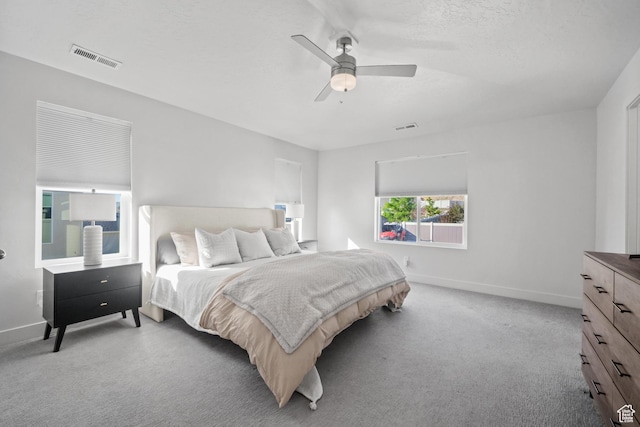 3712 E Long Ridge Dr Unit 124, Eagle Mountain, UT 84005 - bedroom featuring light carpet, a ceiling fan, and a textured ceiling