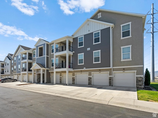 3795 W 2280 N Unit A201, Lehi, UT 84043 - view of property featuring driveway and a garage