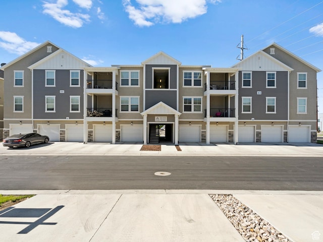 3795 W 2280 N Unit A201, Lehi, UT 84043 - multi unit property featuring an attached garage and board and batten siding