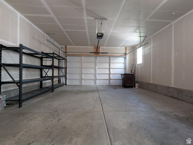 5427 W Ranches Loop Dr Unit 129, West Jordan, UT 84081 - garage featuring a garage door opener