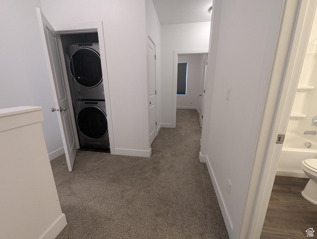 5427 W Ranches Loop Dr Unit 129, West Jordan, UT 84081 - washroom featuring stacked washer and clothes dryer and carpet floors