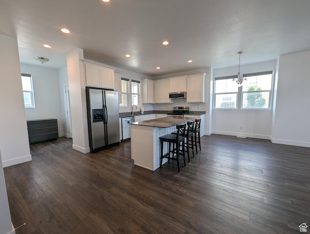 5427 W Ranches Loop Dr Unit 129, West Jordan, UT 84081 - kitchen featuring stainless steel appliances, healthy amount of natural light, white cabinets, and recessed lighting