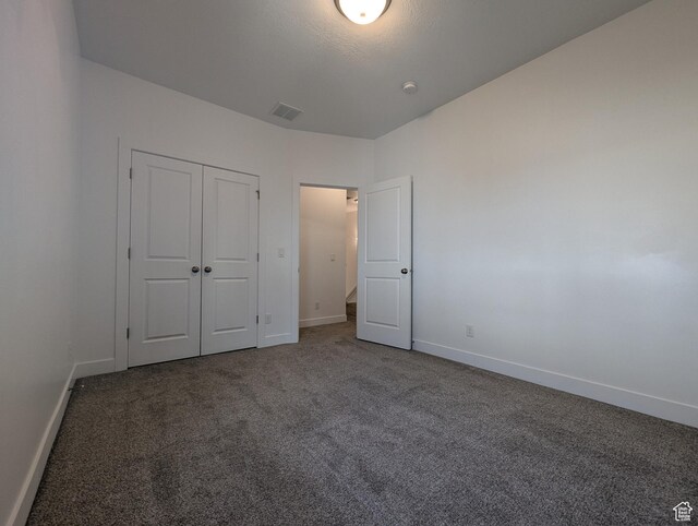 5427 W Ranches Loop Dr Unit 129, West Jordan, UT 84081 - unfurnished bedroom featuring carpet and a closet
