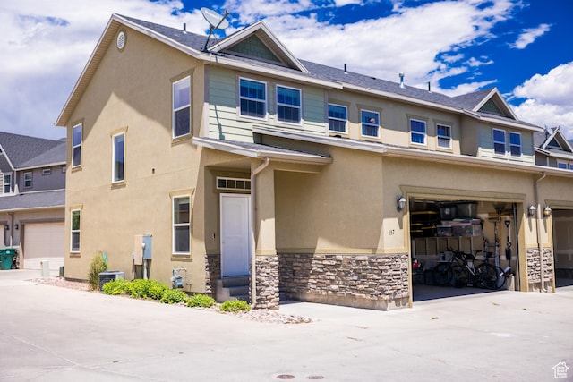 357 E 535 S, Vernal, UT 84078 - view of front of property with stone siding, stucco siding, and an attached garage