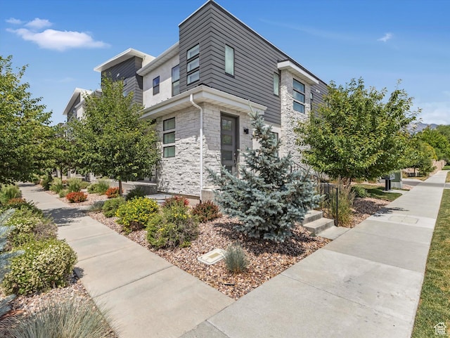 9217 S Holiday Bowl Ct E, Sandy, UT 84094 - view of property exterior featuring stone siding