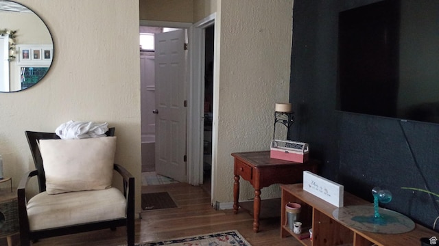 131 6th W, East Carbon, UT 84520 - living area featuring wood finished floors and a textured wall