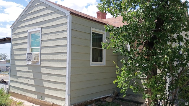 131 6th W, East Carbon, UT 84520 - view of home's exterior featuring a chimney and cooling unit