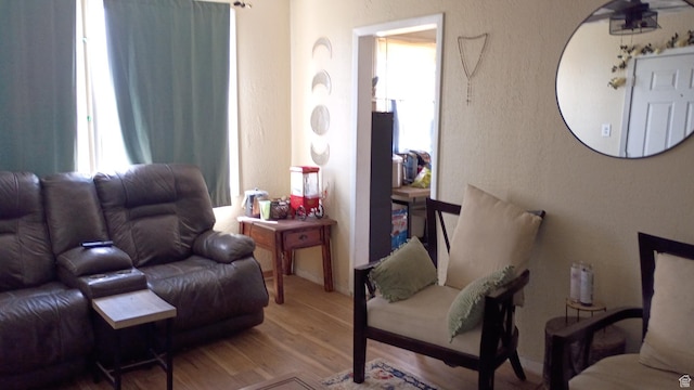 131 6th W, East Carbon, UT 84520 - living room with wood finished floors and a textured wall
