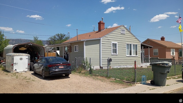 131 6th W, East Carbon, UT 84520 - view of side of home with a carport and a chimney