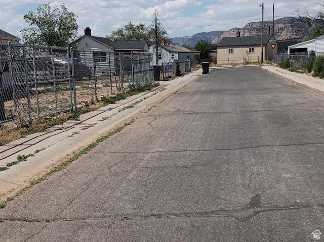 131 6th W, East Carbon, UT 84520 - view of asphalt street featuring sidewalks, curbs, a residential view, and a mountain view