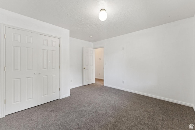 827 S 1030 W, Richfield, UT 84701 - unfurnished bedroom featuring carpet flooring, a textured ceiling, and a closet