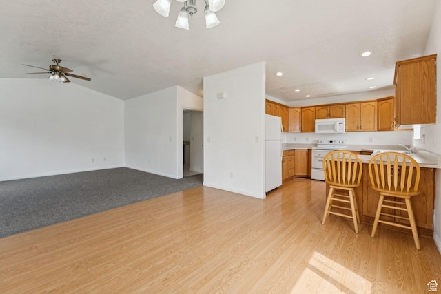 827 S 1030 W, Richfield, UT 84701 - kitchen with white appliances, a ceiling fan, a peninsula, open floor plan, and recessed lighting