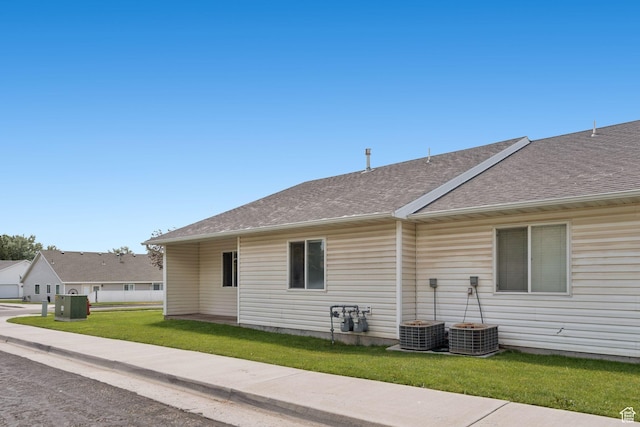 827 S 1030 W, Richfield, UT 84701 - view of home's exterior with a shingled roof and a yard