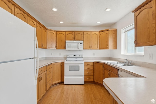 827 S 1030 W, Richfield, UT 84701 - kitchen with white appliances, light wood-style floors, light countertops, recessed lighting, and a textured ceiling