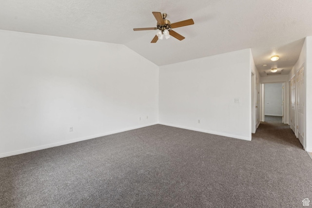 827 S 1030 W, Richfield, UT 84701 - empty room with dark carpet, ceiling fan, vaulted ceiling, and a textured ceiling