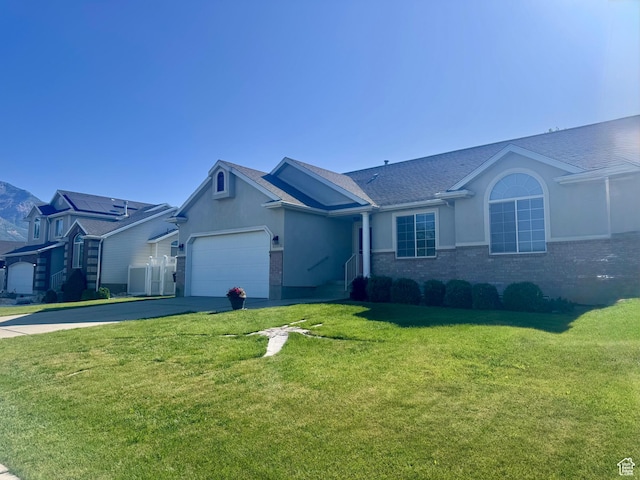 1730 N 350 W, North Ogden, UT 84414 - ranch-style home featuring concrete driveway, a garage, a front lawn, stucco siding, and brick siding