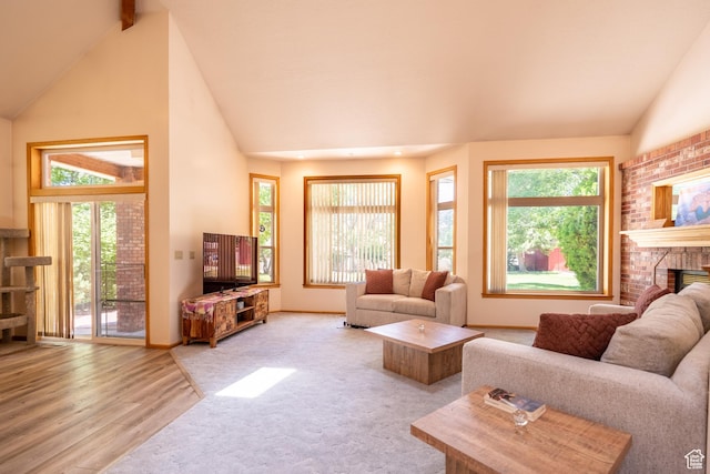 4163 S Beeman Rd, Moab, UT 84532 - carpeted living room featuring a fireplace and wood finished floors