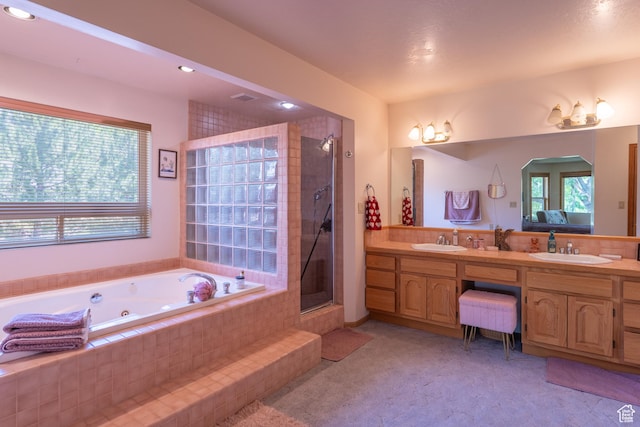 4163 S Beeman Rd, Moab, UT 84532 - bathroom with a whirlpool tub, double vanity, a shower, and recessed lighting