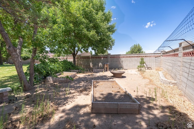4163 S Beeman Rd, Moab, UT 84532 - fenced backyard with a vegetable garden