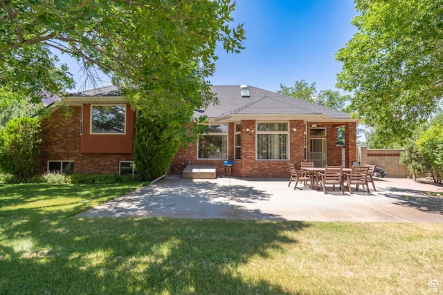 4163 S Beeman Rd, Moab, UT 84532 - rear view of property with a patio area and brick siding