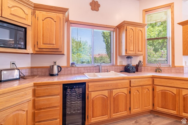 4163 S Beeman Rd, Moab, UT 84532 - kitchen with wine cooler, black microwave, and tile countertops