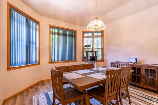 4163 S Beeman Rd, Moab, UT 84532 - dining space with a chandelier and wood finished floors