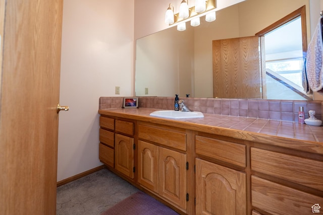 4163 S Beeman Rd, Moab, UT 84532 - bathroom featuring vanity and baseboards