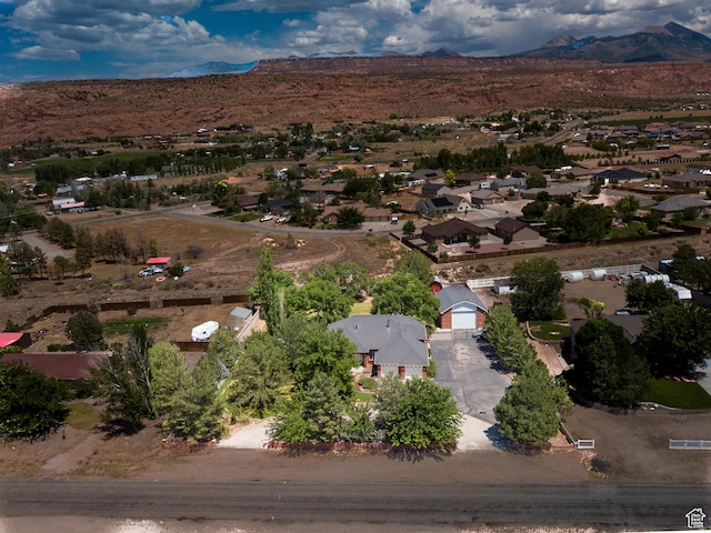 4163 S Beeman Rd, Moab, UT 84532 - aerial perspective of suburban area with a mountainous background