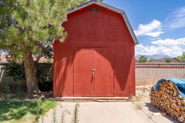 4163 S Beeman Rd, Moab, UT 84532 - view of shed featuring a fenced backyard and a mountain view