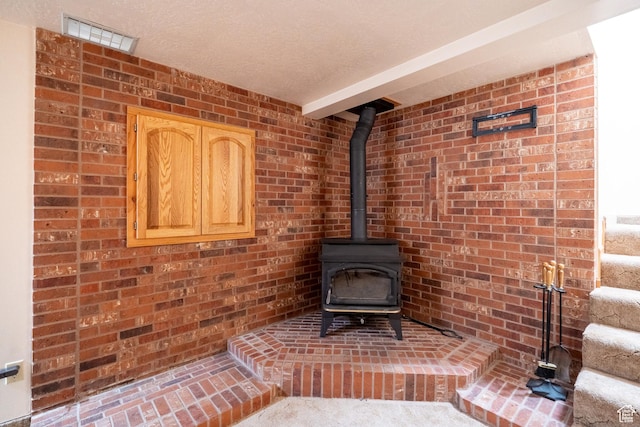 4163 S Beeman Rd, Moab, UT 84532 - detailed view of a wood stove, brick wall, and beam ceiling