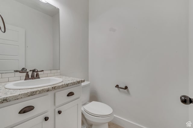 8069 N Quarter Mile Dr, Eagle Mountain, UT 84005 - bathroom featuring vanity and tasteful backsplash