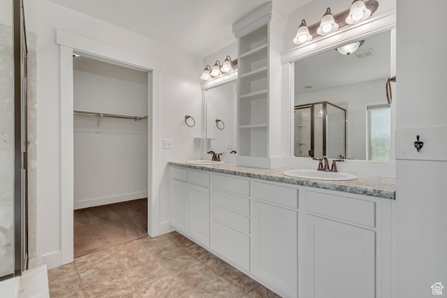 8069 N Quarter Mile Dr, Eagle Mountain, UT 84005 - bathroom with a walk in closet, a stall shower, and double vanity