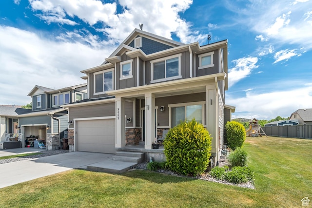 8069 N Quarter Mile Dr, Eagle Mountain, UT 84005 - view of front of house featuring driveway, a garage, board and batten siding, and stone siding
