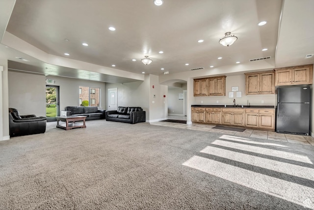 1045 S 1700 W Unit 1213, Payson, UT 84651 - living room featuring light carpet, arched walkways, recessed lighting, and bar with sink