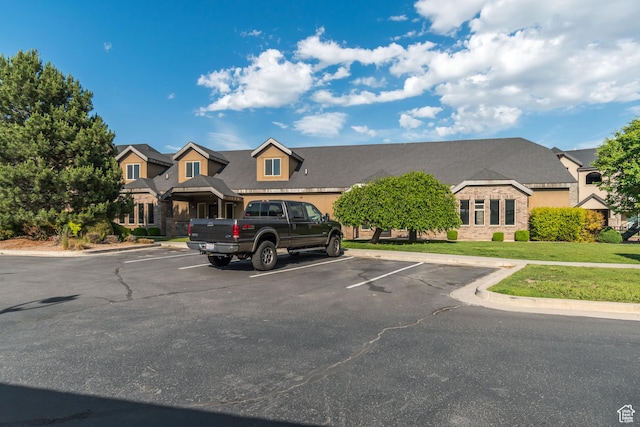 1045 S 1700 W Unit 1213, Payson, UT 84651 - view of front of house with uncovered parking, a front lawn, and stone siding