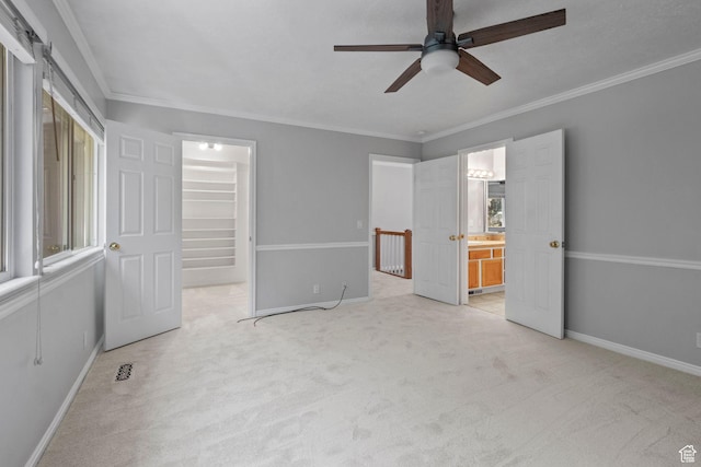 1870 E Monterey Dr, Salt Lake City, UT 84121 - unfurnished bedroom featuring carpet flooring, a walk in closet, crown molding, ensuite bath, and a closet