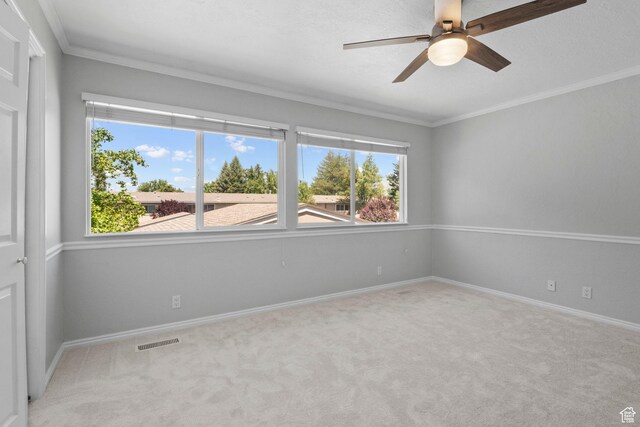 1870 E Monterey Dr, Salt Lake City, UT 84121 - spare room featuring carpet, crown molding, and a ceiling fan
