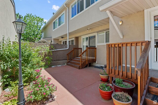 1870 E Monterey Dr, Salt Lake City, UT 84121 - property entrance featuring stucco siding and a patio area