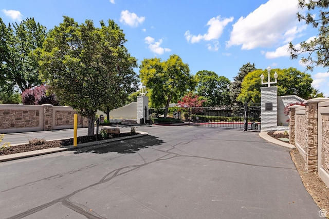 1870 E Monterey Dr, Salt Lake City, UT 84121 - view of asphalt street featuring a gate, a gated entry, and curbs