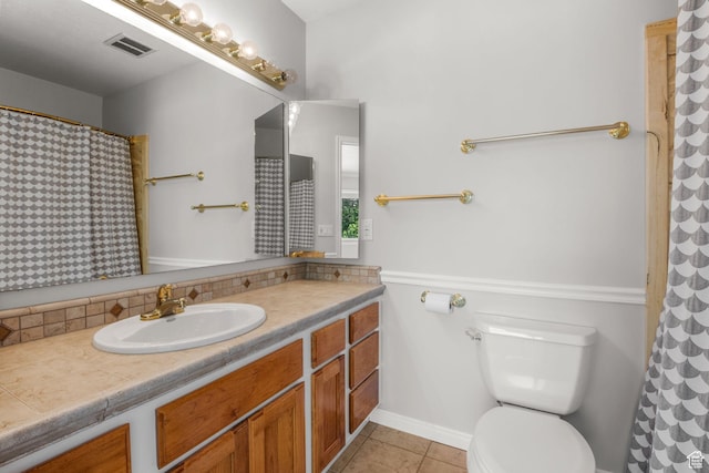 1870 E Monterey Dr, Salt Lake City, UT 84121 - bathroom with vanity, tile patterned floors, and tasteful backsplash
