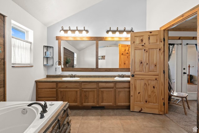 265 S 400 E, Centerfield, UT 84622 - bathroom featuring lofted ceiling, double vanity, a bath, and tile patterned floors