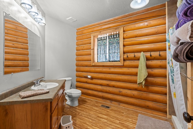 265 S 400 E, Centerfield, UT 84622 - bathroom featuring vanity, wood finished floors, and log walls