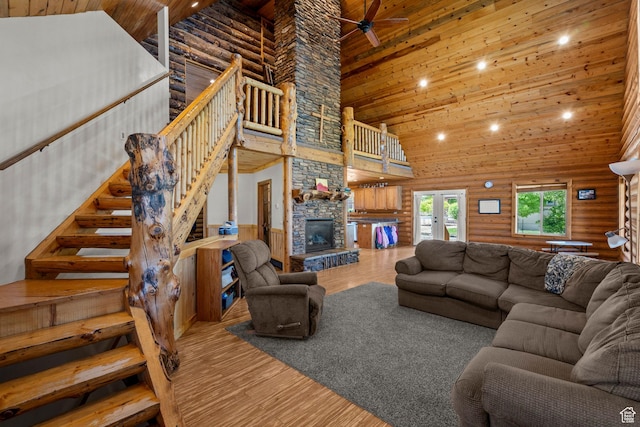 265 S 400 E, Centerfield, UT 84622 - living room with high vaulted ceiling, wood ceiling, wood finished floors, rustic walls, and a fireplace