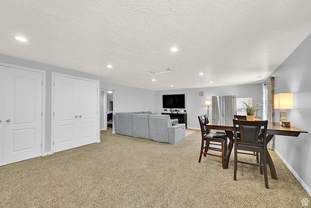 5057 W Eagle Rock Way, West Valley City, UT 84120 - dining space with carpet floors, recessed lighting, and a textured ceiling