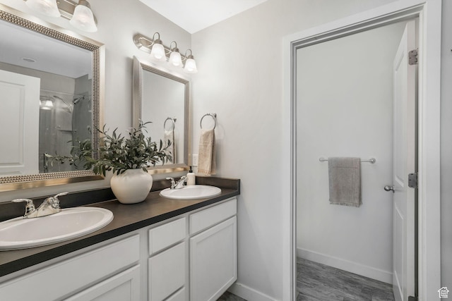 5124 W Stockfield Ln, Herriman, UT 84096 - full bath featuring double vanity, wood finished floors, and a shower