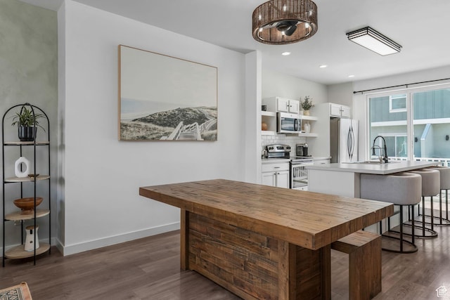 5124 W Stockfield Ln, Herriman, UT 84096 - kitchen featuring appliances with stainless steel finishes, open shelves, white cabinets, dark wood-style flooring, and recessed lighting