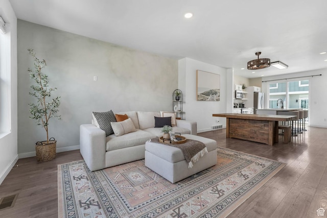 5124 W Stockfield Ln, Herriman, UT 84096 - living area featuring wood finished floors, recessed lighting, and a chandelier